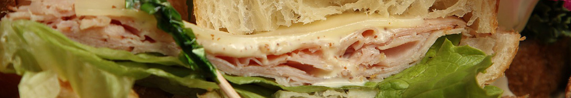 Eating Deli Sandwich at The Ripe Tomato Deli restaurant in Litchfield, CT.